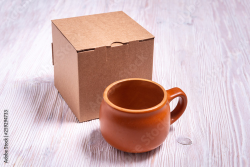 Cardboard box on wooden background