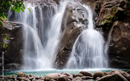 beautiful waterfall with emerald green water