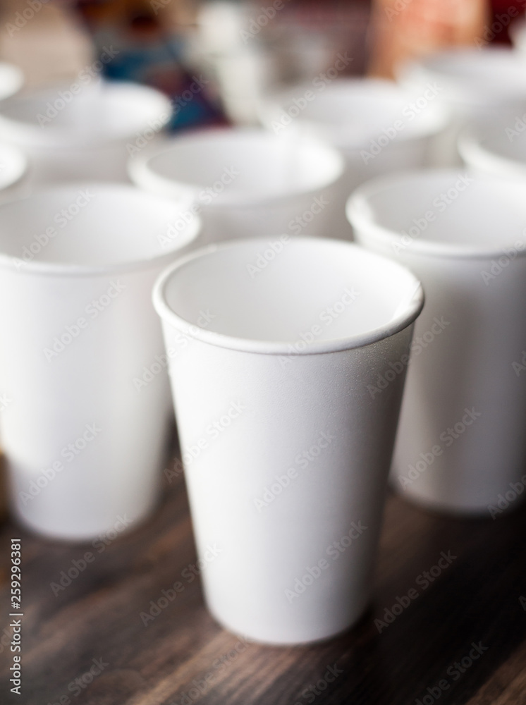 A group of empty coffee cups to serve tea or coffee at an event buffet A group of empty coffee cups to serve tea or coffee at an event buffet