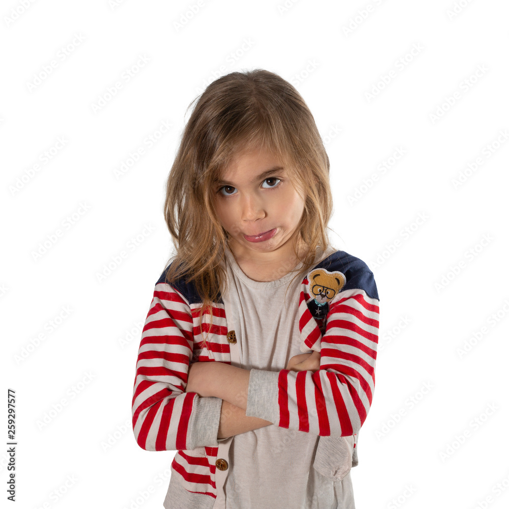 Portrait of a cute girl makes an unhappy expression. Photographed on a white background. Portrait of a cute girl makes an unhappy expression. Photographed on a white background.