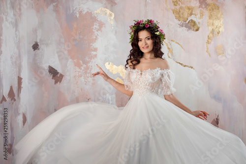 Elegant brunette girl bride. Young beautiful woman in wedding dress