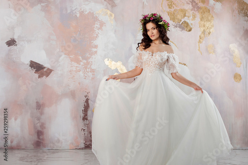 Elegant brunette girl bride. Young beautiful woman in wedding dress