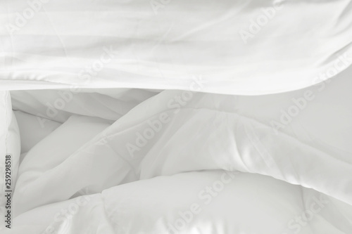 top view of white pillow on bed and wrinkle messy blanket in bedroom after wake up in the morning © Nattha99