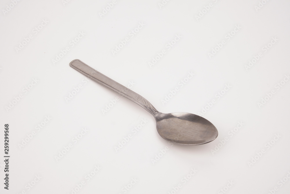 Steel silver spoon isolated on white background Steel silver spoon isolated on white background