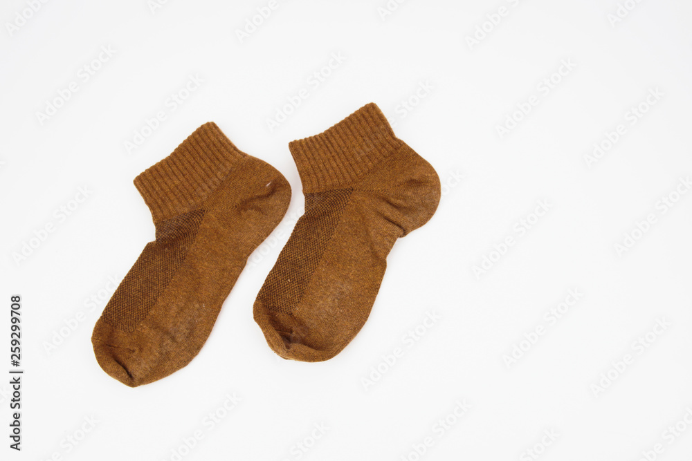 A pair of brown socks isolated on white background A pair of brown socks isolated on white background