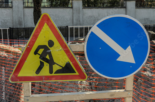 Road sign repair work and detour arrow