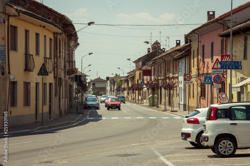 car in street on the small town in Italy.