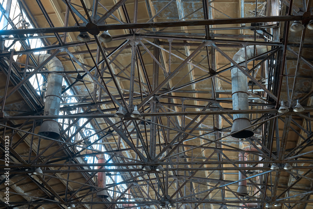 ceiling of old abandoned factories with windows and hoods