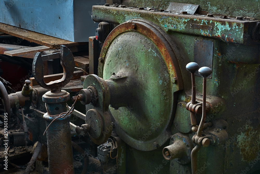 old rusty dirty machines and mechanisms in an abandoned factory