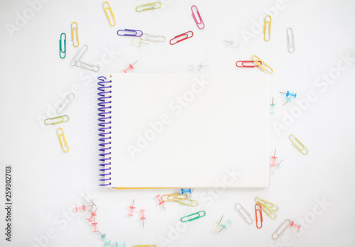 Bright stationery for study: paper, felt-tip pens, scissors, paper clips