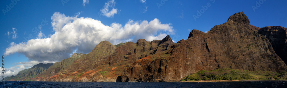View from a boat towards the famous Na Pali Coast on the northern coast of Kauai, Hawaii, USA. View from a boat towards the famous Na Pali Coast on the northern coast of Kauai, Hawaii, USA.