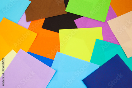 Colorful paper scatter on background. Top view  flat lay concept.