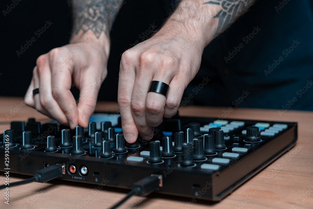 Dj man creates electronic music in the studio Dj man creates electronic music in the studio