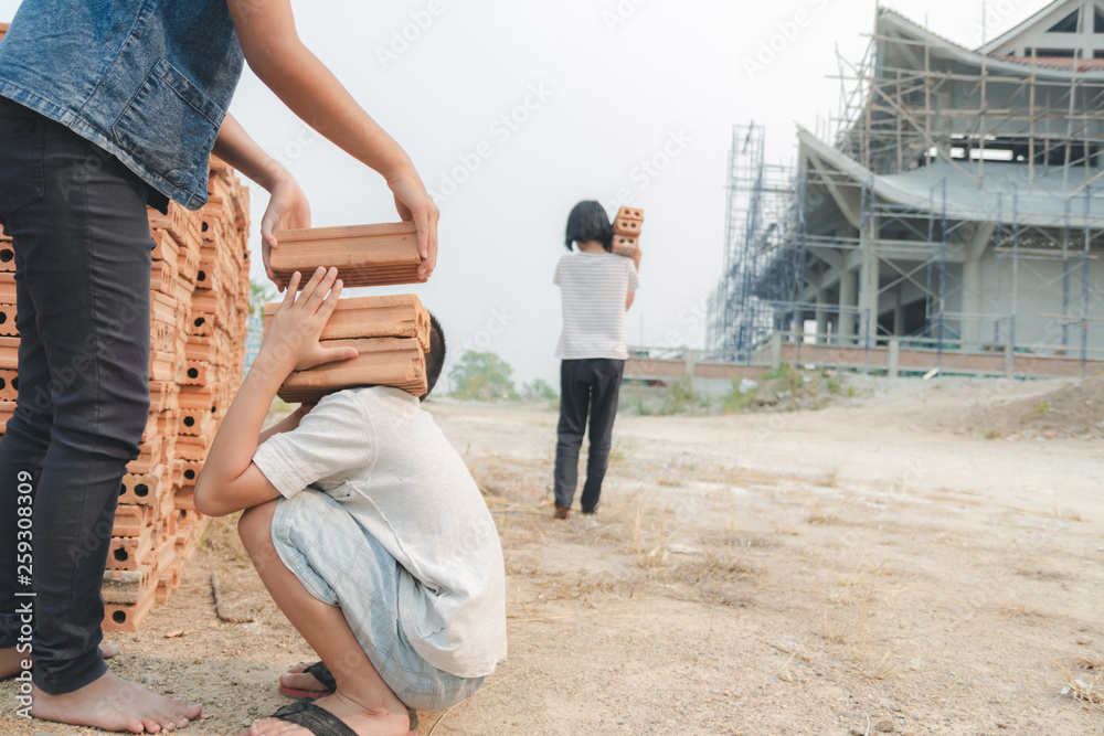 Children working in a brick factory. world day against child labour concept Children working in a brick factory. world day against child labour concept