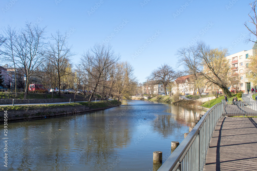  Spring embankment of the river Oder on a sunny day, Poland