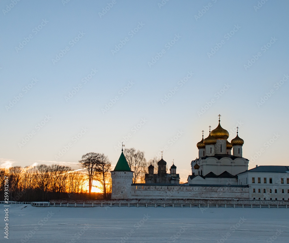 Fototapeta premium Old architecture of russian town. Beautiful church, domes, stone walls...