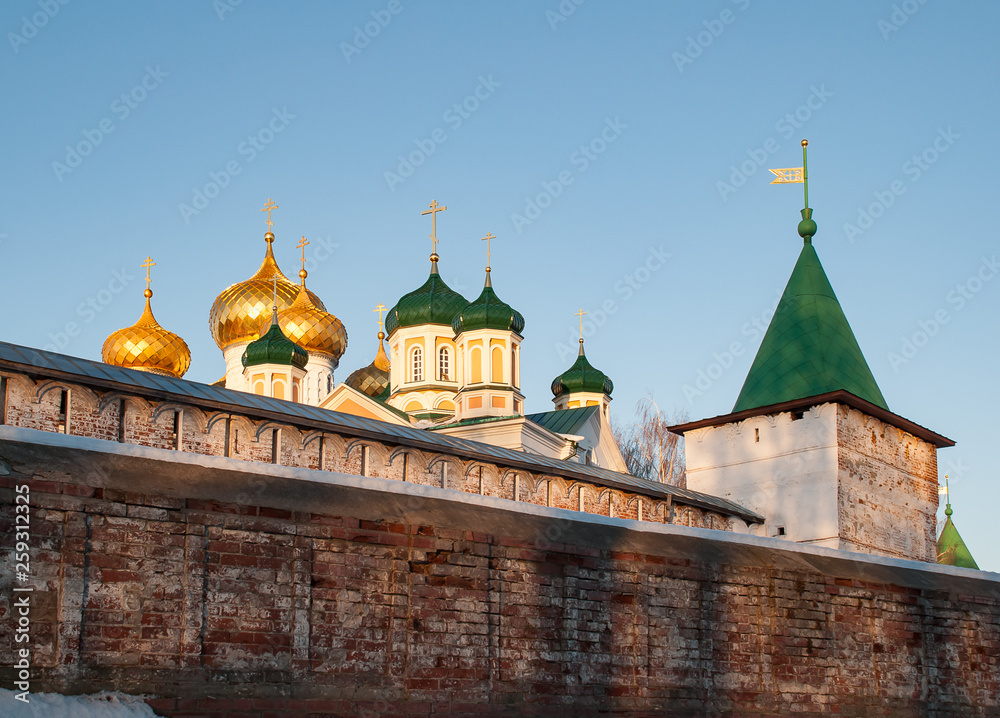 Old architecture of russian town. Beautiful church, domes, stone walls...