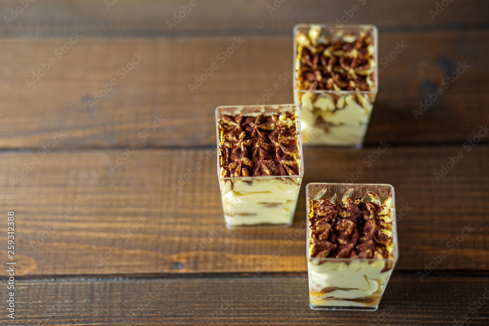 Dessert with mascarpone in cups. Concept for food, parties, desserts and cafes. Dessert with mascarpone in cups. Concept for food, parties, desserts and cafes.