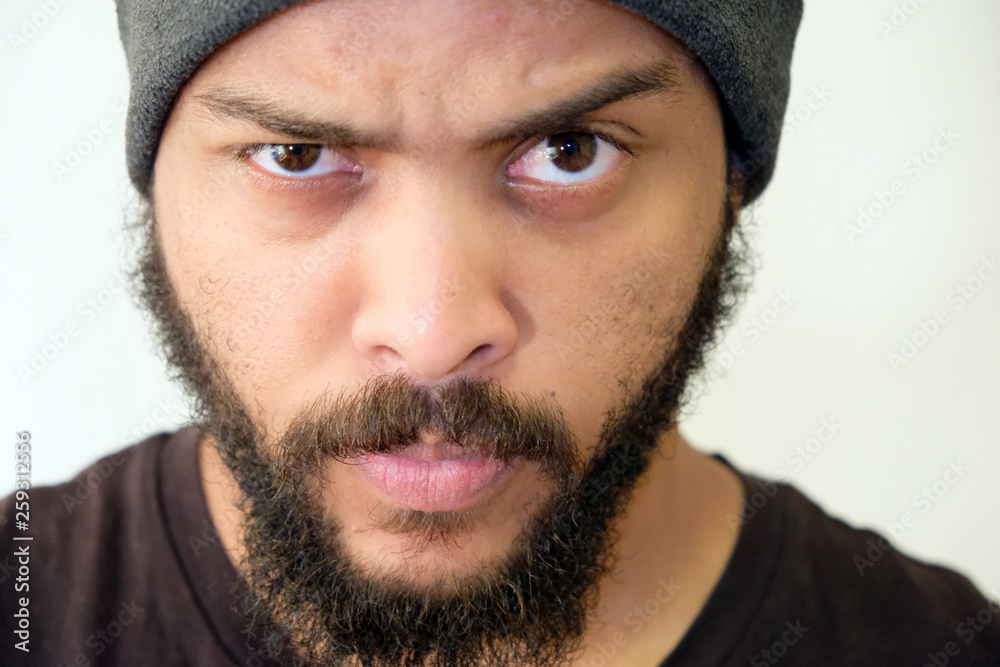 Mixed Race Man with beard close up portrait eyebrow Mixed Race Man with beard close up portrait eyebrow