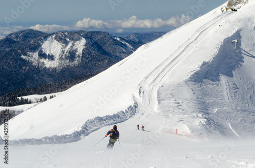 Skiers on the top of the Caucasus mountains in the ski resort Krasnaya Polyana Russia © Svetlana