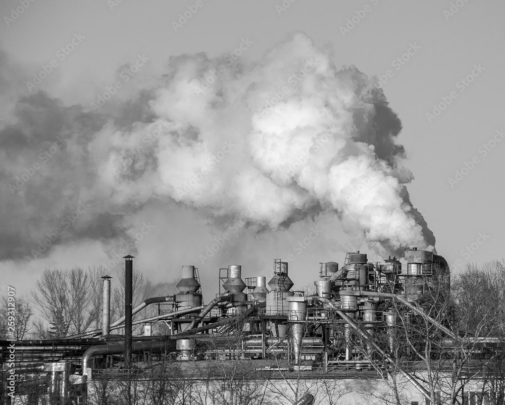 Smoke on the sky. Working factory in the city, dirty emission Smoke on the sky. Working factory in the city, dirty emission