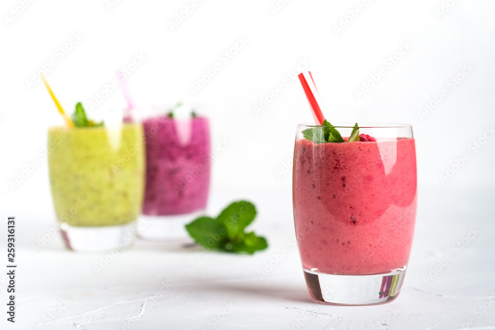 Fruit and berry smoothie blend at home on a light background Fruit and berry smoothie blend at home on a light background