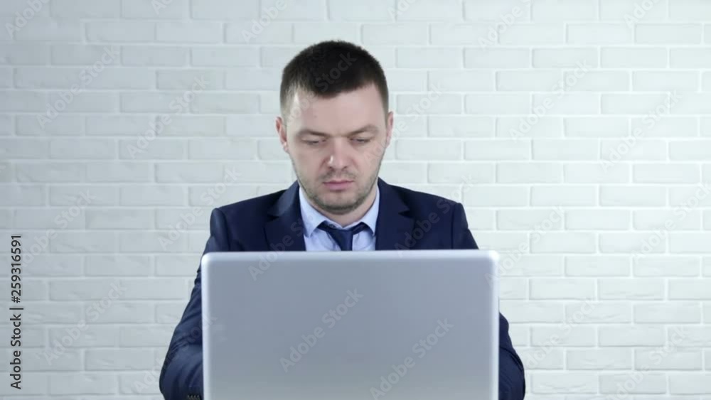 Tired sleepy businessman sitting with closed eyes at workplace, overworked man falling asleep at work Tired sleepy businessman sitting with closed eyes at workplace, overworked man falling asleep at work