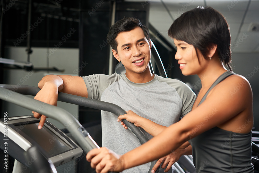 Woman training with instructor