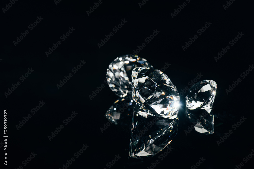 transparent pure diamonds isolated on black with reflection - obrazy, fototapety, plakaty 