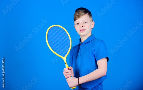 Sport shop. Little boy. Fitness diet brings health and energy. Sport game shop. Gym workout of teen boy. Happy child play tennis. Tennis player with racket. sport equipment in shop. Sport tool shop