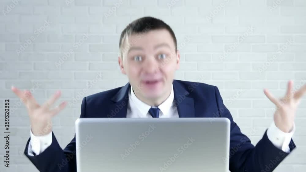 Boss shouting at his employee sitting at the office table Boss shouting at his employee sitting at the office table