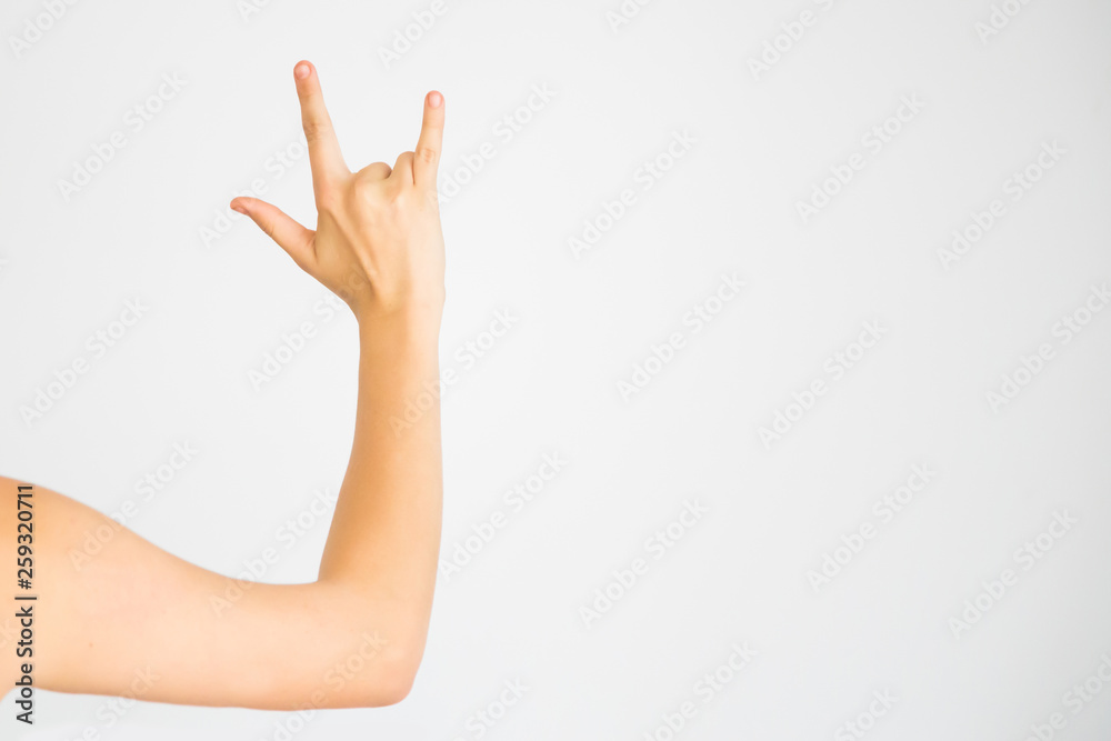 hand on white background showing a rock sign hand on white background showing a rock sign