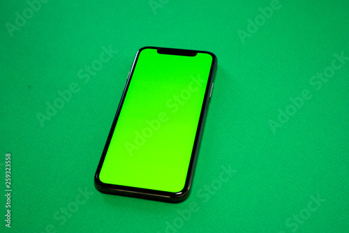 iPhone XS, Phone smartphone, green screen on Green background, top view