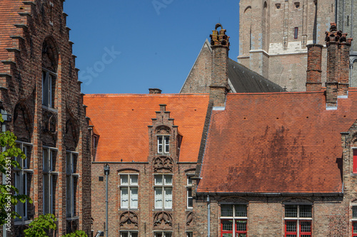 Bruges, Belgium. Medieval brickwork building in downtown historic center of Brugge, gothic city in West Flanders. photo