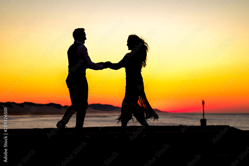 Awesome silhouette of a couple dancing  