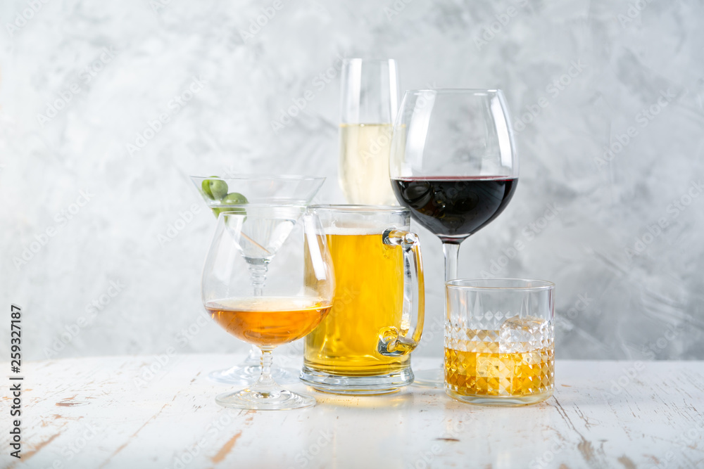 Selection of alcoholic drinks - beer, wine, martini, champagne, cogniac, whiskey Selection of alcoholic drinks - beer, wine, martini, champagne, cogniac, whiskey