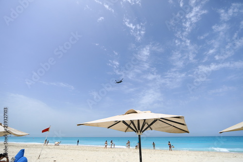 military helicopter over the beach
