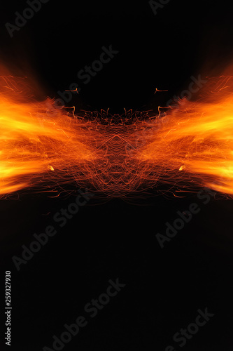 Abstraction, burning fire with sparks. Mystical prototype with patterns for the background. Horizontal reflection.