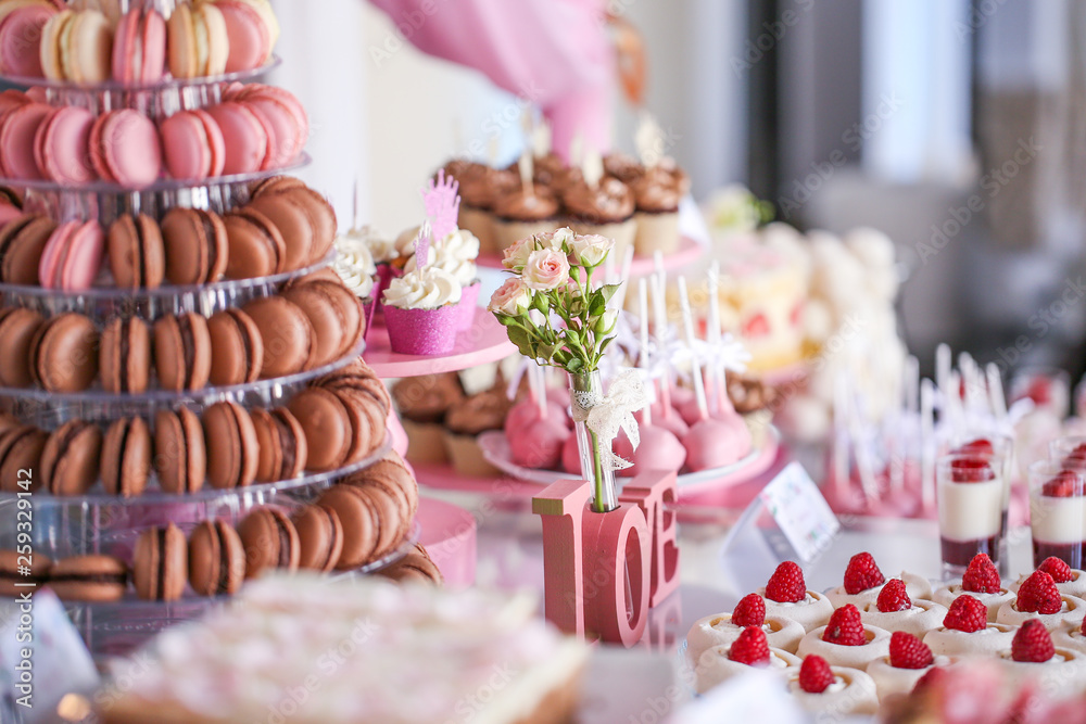 Candy bar with delicious mini cakes, selective focus