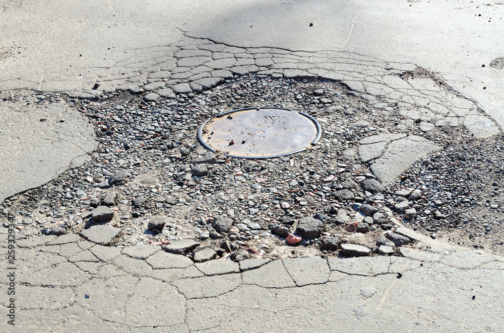 pensionist gear tvetydigheden Destroyed asphalt pavement around sewer hatch Stock Photo | Adobe Stock