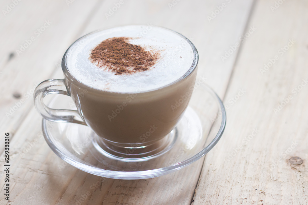 Cup with coffee on a wooden background. Coffee drink. Hot drink. Cappuccino Cup with coffee on a wooden background. Coffee drink. Hot drink. Cappuccino