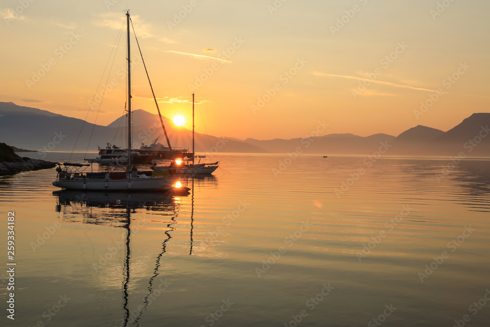 Beautiful sunrise off the coast of the Meganisi island, Ionian sea, Greece.