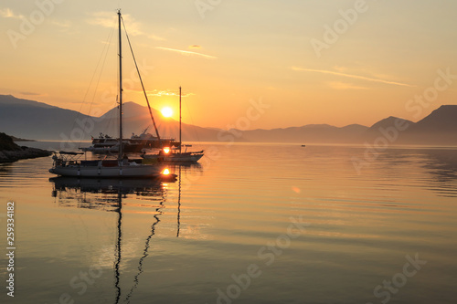 Beautiful sunrise off the coast of the Meganisi island, Ionian sea, Greece.