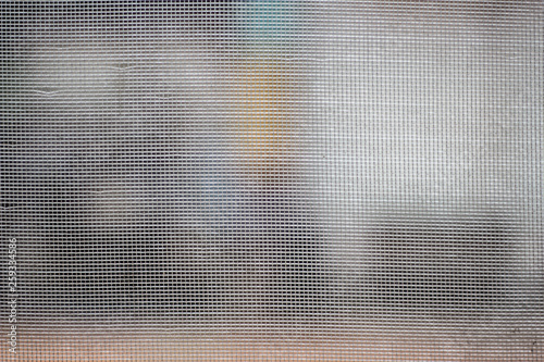 Selective focus of mosquito wire screen and some of broken on blurred nature background in the afternoon of the day