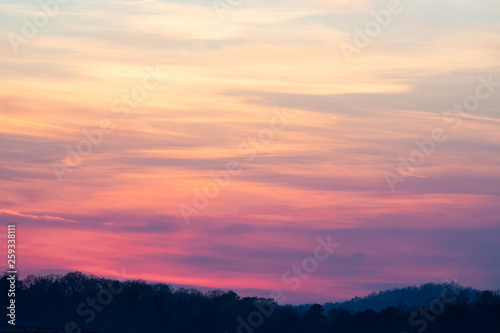 sky and clouds over hills at sunset