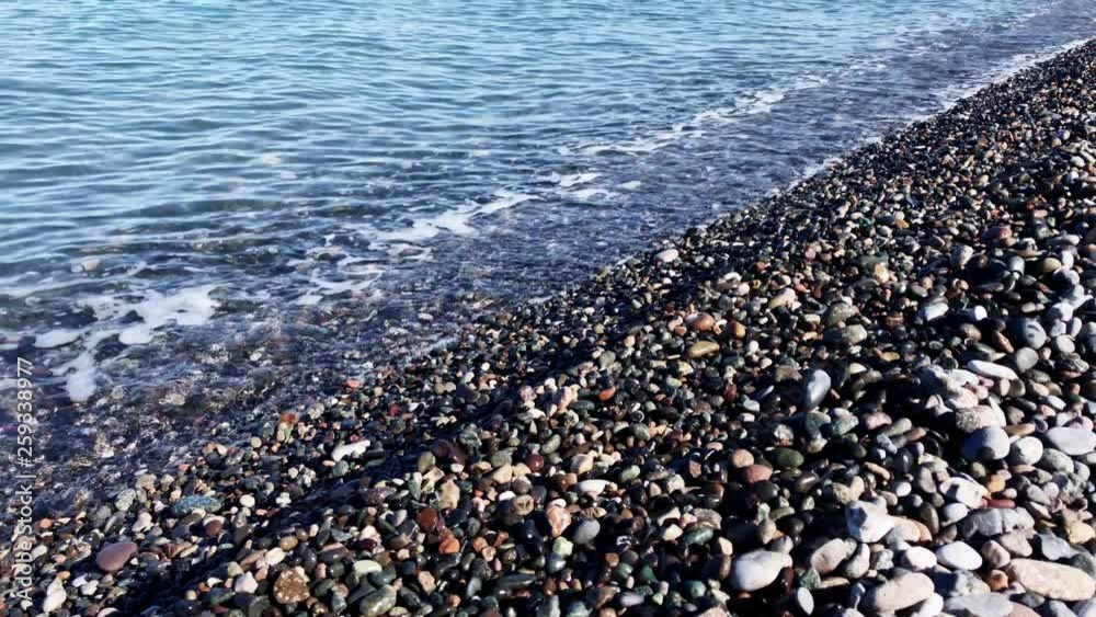 Sea pebbles beach and at the sunny day Sea pebbles beach and at the sunny day