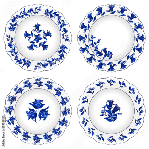 Set of decorative porcelain plates ornate with traditional blue floral pattern  in Russian style Gzhe