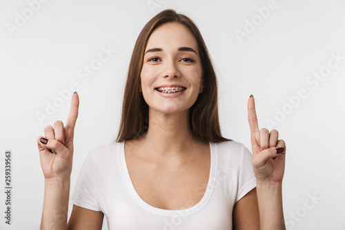 Attractive young woman standing isolated