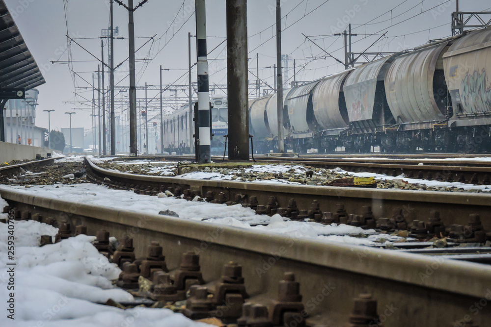 Slavonski Brod, Croatia 1/31/2019: Train station covered with snow with foggy day Slavonski Brod, Croatia 1/31/2019: Train station covered with snow with foggy day