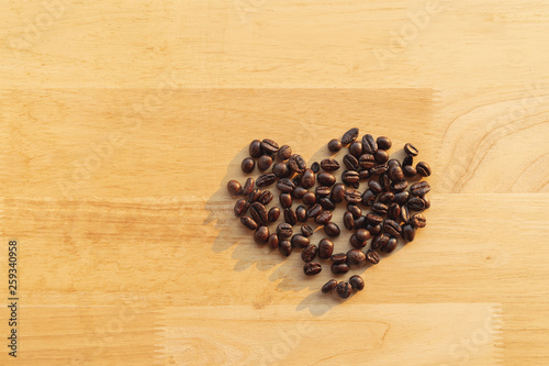 Top view coffee beans on wooden table 